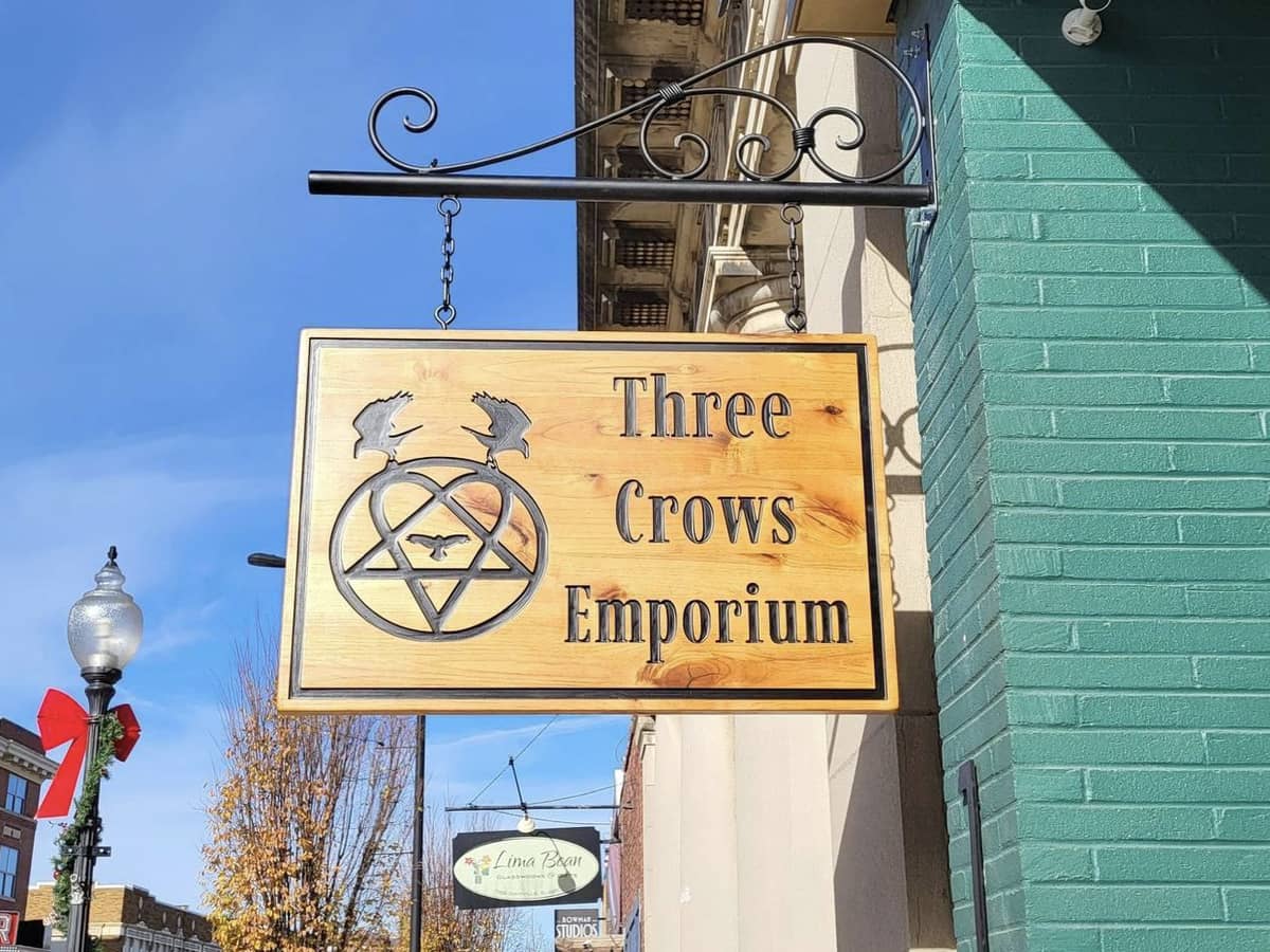 A sign for Three Crows Emporium