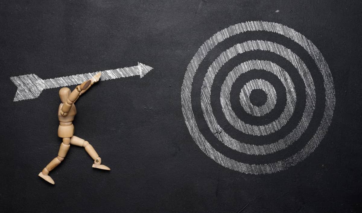 A graphic of a man throwing an arrow at a bullseye