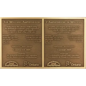 Bilingual cast bronze park dedication plaque for an amphitheatre featuring English and French text.